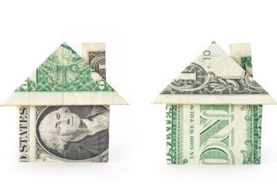 Two origami houses made from U.S. dollar bills representing changing property values in DC, Maryland, and Virginia with Matt Cheney and Cheney and Co.