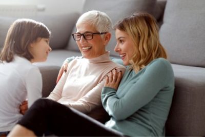 Multi-generational family at home, grandmother, mother, and child spending time together
