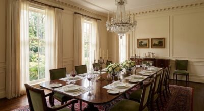 Elegant formal dining room with crystal chandelier and mahogany table in a Washington DC estate home