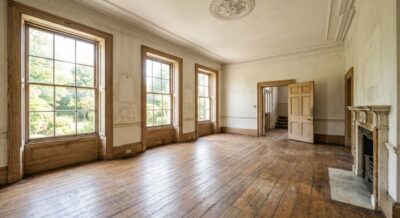 Unfurnished luxury home interior with original crown molding and hardwood floors in Washington DC